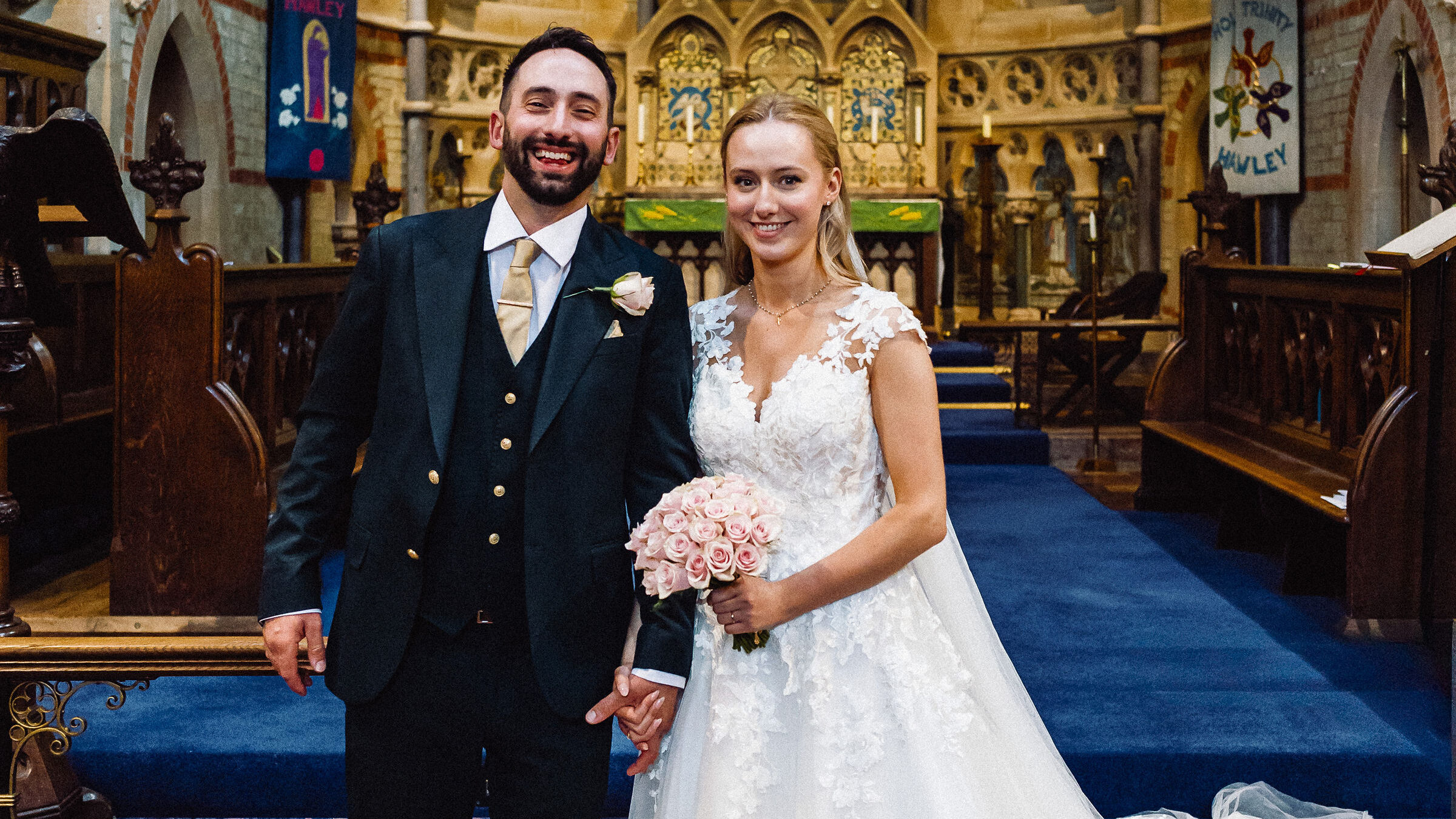 A photo of a smiling happy couple just married in the church.