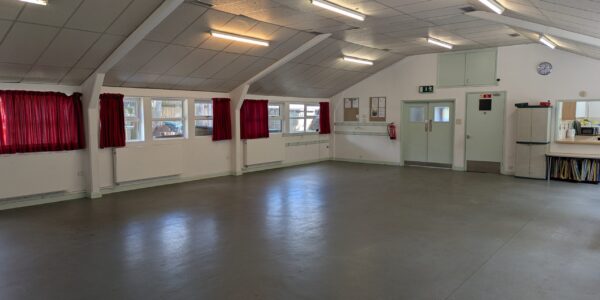 The inside of Trinity Hall showing the entrance door and door to disabled toilet.